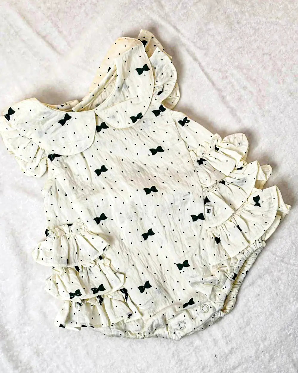 Cute Cream Baby Romper Dress with Green Bow Print & Ruffle Details